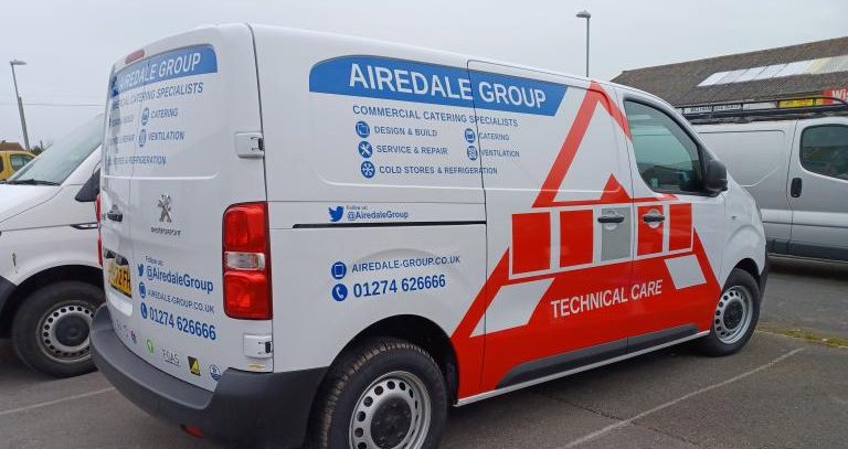 Airedale Group van parked in car park to show side panel